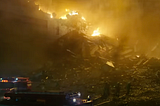 Scene of burning buildings at Chernobyl nuclear reactor site.