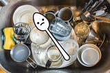 A dirty sink and a sad teaspoon.