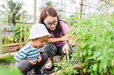 mother and son learning in their garden while homeschooling