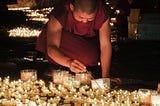 This picture is taken at a sacred cave on the Tibet plateau. In Tibetan beliefs, the light of the Ghee Lamp is a symbol of the Buddha’s wisdom and can dispel the darkness of ignorance. 中文（繁體）：拍攝於青藏高原一處神聖的洞穴，酥油燈的光明象徵著可以驅散眾生心中無明黑暗的佛陀智慧。