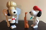 Two 6-inch, McDonald’s Snoopy figurines: Snoopy as a chef and Snoopy as an artist.