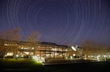 Star trails over the front of the Steve Jobs building at Pixar Animation Studios