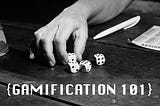 Cover image with GAMIFICATION 101 written on it. (A picture of human hand rolling some dies on the table)