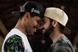 Gay male couple photo shoot with beard and noses touching