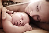 A newborn baby with its mother.