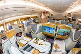 How do you upgrade an Emirates flight?