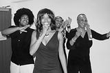 a family of four acting as tina turner, ike and the ikettes