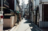 Back alley of Korea, showing residential & commercial buildings.