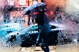 A window obscured by rain, and through it, there is a person dressed in black carrying a black umbrella.