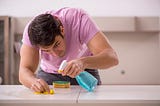 photo of a young man cleaning