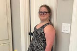 Sarah Grace wearing a cheetah print dress