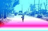 Boy chasing after a truck with pink and blue overlay