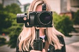 Woman holding video camera