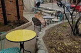 A picture of the outdoor patio at a hipster craft beer place in the big city. The running club would meet here after Tuesday night runs. I took this picture during a spring Marathon Race in March 2017. I just watched the race — photo by the author.