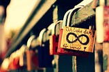 Image by Missy from Pixabay of a love lock or padlock at a castle with the infinity sign drawn with black marker and the German words “ich liebe dich” meaning I love you” in English