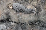 Painting by artist Tim Lowly of his disabled daughter Temma. She is wearing gray clothing and lying motionless on the dry earth, weeds and small pebbles scattered on the dirt.