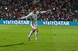 Cristiano Ronaldo running on the field with his arms open