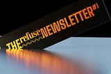 A realistic, 3D render of typography engraved in gold, on a black rectangle. Typography reads: The Refuse Newsletter #1.