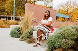 Kacyn smiles for a photo outside Andersen Hall