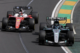 George Russell of Mercedes passing Charles Leclerc of Ferrari