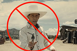 Buster Scruggs in a white shirt with a white hat, pointing a gun at the camera, with a nuke sign added.