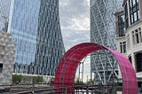 A circular sculpture over a bridge in Canary Wharf, London