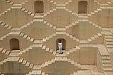A woman in a labyrinth of stairs