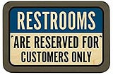 Picture of a sign saying Restrooms are reserved for customers only