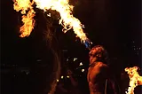 Performer plays with fire