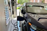 An EV being charged in a garage