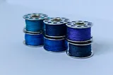 Rolls of royal blue thread.