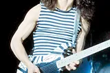 Eddie Van Halen plays guitar onstage