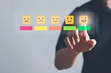 A graphic of someone selecting the highest rating in a scale of happy faces.