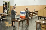 A black woman is voting in 1964