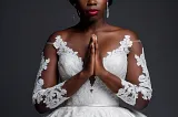 A sad beautiful black woman in a pretty wedding dress. Meta AI