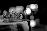 A jeweled crown sits on a table