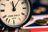 A clock, coins, and part of a Union Jack flag.