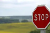 Stop sign in a field.