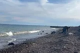 On the shores of Lake Superior in Duluth, MN. A group of college students are getting familiar with the cold water and ripping winds on a brisk 37° F day.