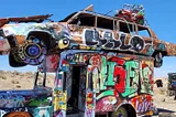 Junked vehicles covered in graffitis.