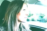 Author profile as she drives in car.