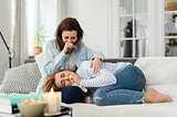Photo of Women Crying on a Couch
