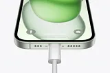 iPhone 15 Pro charging through a wired