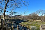 the Welsh countryside with mountains in the background