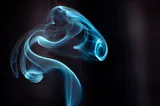 Photo of smoke rising from a stick of incense.