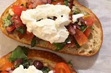 Bruschetta and burrata on sourdough bread.