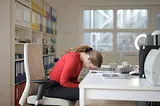 Woman leaning on laptop