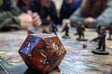 Friends gather around a table, enjoying a thrilling board game with miniature figures and dice.