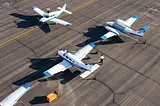 Photo of small airplanes on the tarmac.