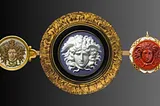 Images of 3 round Medusa cameos made by 3 different designers. One mosaic, one Wedgwood blue, one carnelian. Each encircled with gold.